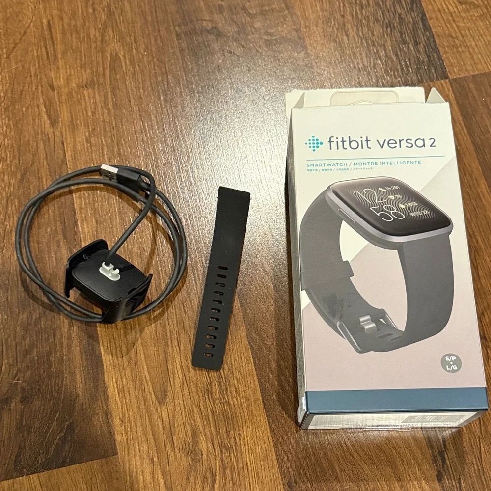 ACCESSORY ONLY - selling my charger and extra band because I lost my Fit Bit